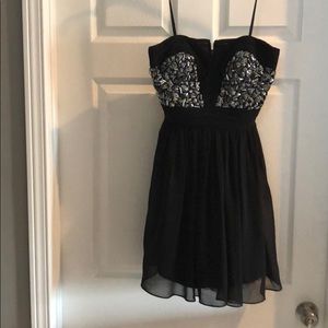 Black ruched and beaded cocktail dress